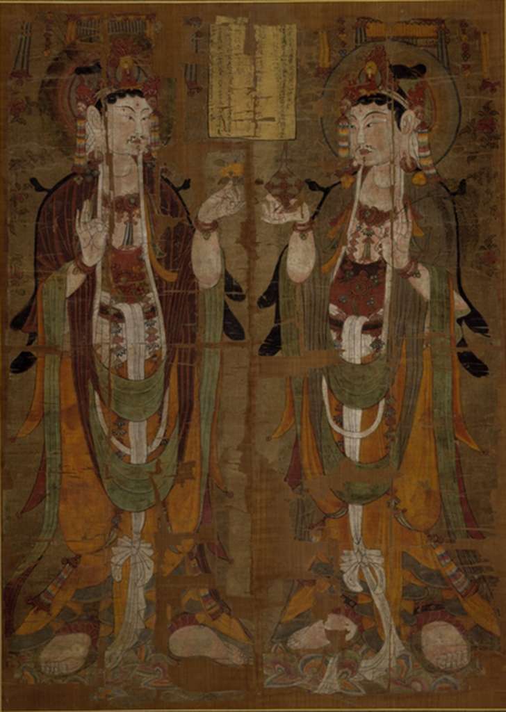 British Museum Top 20 Buddhism 04-1 Dunhuang Two standing Avalokiteshvara 4-1. Two Standing Avalokiteshvara - Cave 17 Dunhuang China, mid 9C AD, 147 x 105 cm. The British Museum has many artifacts that are not on display, like this one of almost 400 priceless Buddhist paintings on silk from the Dunhuang cave complex in China from the Stein collection. The painting shows two almost identical figures of Avalokiteshvara, one of the most popular of the bodhisattvas, identifiable by the small figure of the Buddha Amitabha in his headdress. One of the only differences between the two figures are the attributes that they hold: that on the left holds a flower, that on the right a vase and a willow branch. All three were popular attributes of Avalokiteshvara. The inscription in the centre of the painting translates in part: '�the disciple of pure faith, Yiwen, on his own behalf, having fallen [into the hands of the Tibetans], hopes that he return to his birthplace.' Therefore this example was commissioned to ensure a peaceful life during the period of war with the Tibetans, who finally had to give up Dunhuang in 948 AD. For more information on Dunhuang, check out <a class='a' href='http://idp.bl.uk/idp.a4d'>The International Dunhuang Project</a>. Photo: http://www.britishmuseum.org.